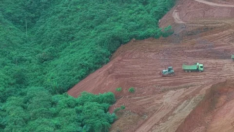 The process of unloading soil in road construction, a truck is loading soil.. Stock Footage 334273002