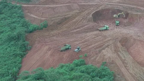 The process of unloading soil in road construction, a truck is loading soil.. Stock Footage 334273191