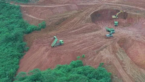The process of unloading soil in road construction, a truck is loading soil.. Stock Footage 334273661
