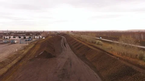 The process of unloading sugar beets. Heap of licorice. The movement of trucks Stock Footage 170314077