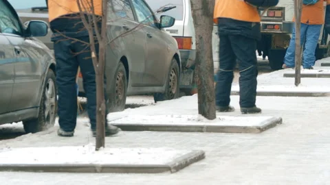 Process of urban street cleaning sweeping. Worker with broom Stock Footage 103100916