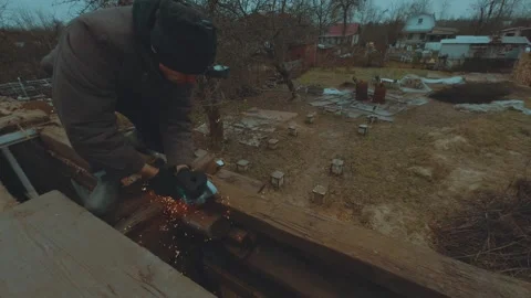 The process of using a Bulgarian saw, sawing metal Stock Footage 321878619