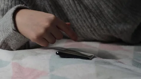 The process of using a smartphone. Close-up of a girl's hands. Stock Footage 225839956