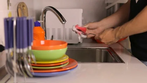 The process of washing dishes in the sink Stock Footage 79259472