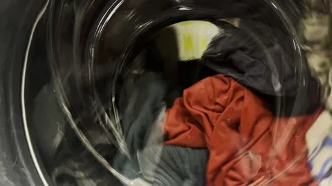 The process of washing things in a washing machine. Clothes are washed in a Stock-Footage 275242695