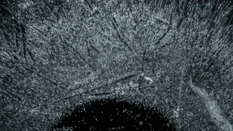 Process of water icing. Time lapse. With black background. Stock Footage 86597470