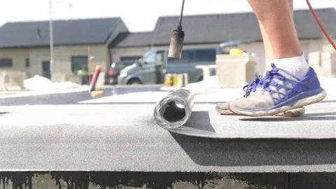 Process of waterproofing the basement of bungalow building by asphalt strip Stock Footage 253577942