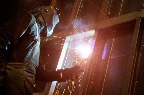 The process of welding a vertical joint in a product. Stock Photos