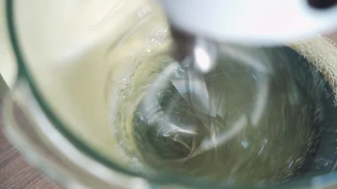 The process of whipping protein in a food processor for baking.  Stock Footage 132086966