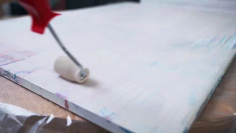 Process of whitening canvas surface with dense white paint and brush roller Stock Footage 302012066