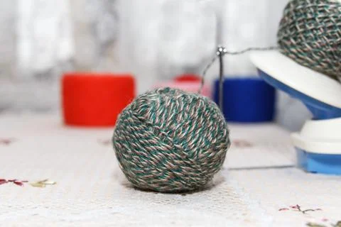 The process of winding wool green yarn from tangle to winding, using a coile Stock Photos