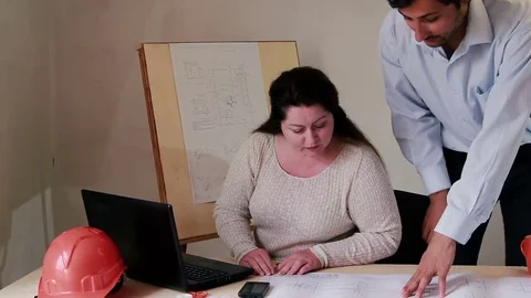 Process of working with drawings of two employees Stock Footage 76690424