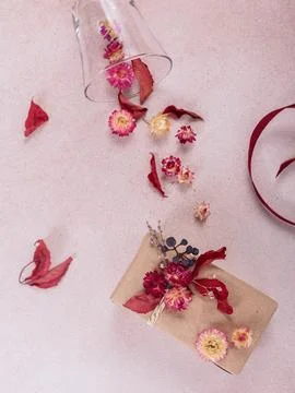 Process of wrapping and decorating presents with dried flowers Stock Photos
