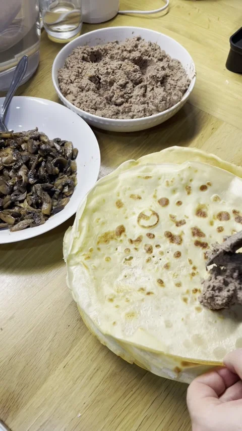 The process of wrapping pancakes with filling Video stock 329423029