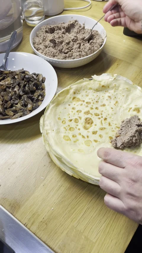 The process of wrapping pancakes with filling Video stock 329423070
