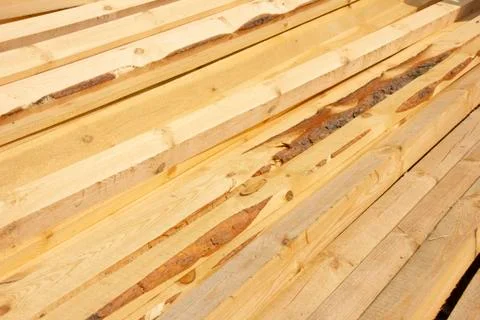 Processed boards at a sawmill. Smooth, turned, polished boards at a wood proc Stock Photos