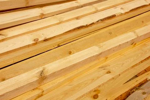Processed boards at a sawmill. Smooth, turned, polished boards at a wood proc Stock Photos