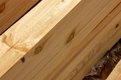 Processed boards at a sawmill. Smooth, turned, polished boards at a wood proc Stock Photos