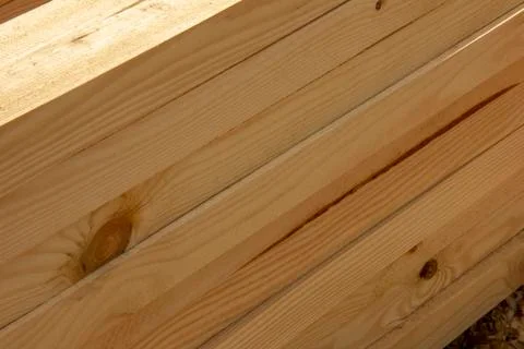Processed boards at a sawmill. Smooth, turned, polished boards at a wood proc Stock Photos