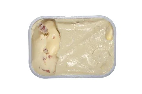 Processed cheese with ham in an open package. Stock Photos