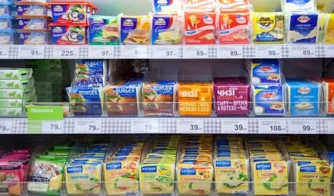 Processed cheese on shelves of superma Stock Photos