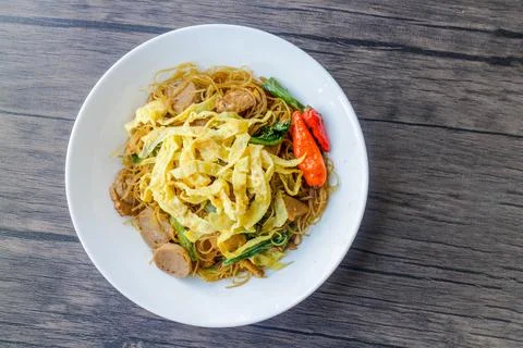 Processed fried vermicelli cooked with pieces of meat and eggs. The taste i.. Stock Photos