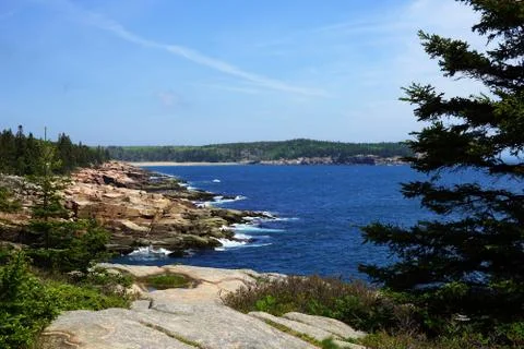 Processed by: Helicon Filter; Shoreline view with boulders and surf breaking  Stock Photos