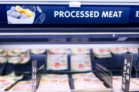Processed Meat signage at the meat section of supermarket with defocused back Stock Photos