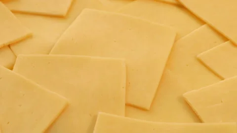 Processed Red Cheese Slices Moving Shot Stock Footage 131624360