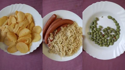 Processed snack foods on separate plates Stock Footage 340220759