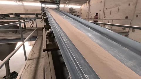 Processed soil going into conveyor line Stock Footage 283428473