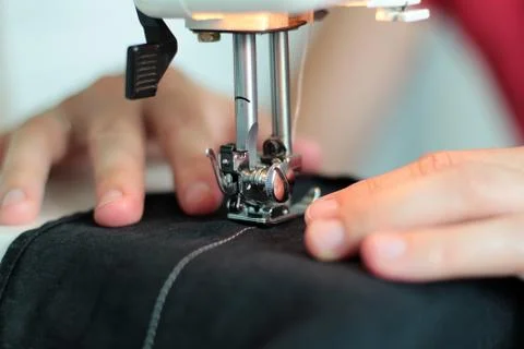 Processes of sewing Linum on the sewing machine sew women's hands sewing mach Stock Photos