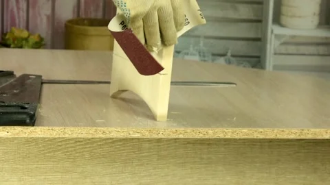 Processing and sanding of a wooden surface with sandpaper Stock Footage 130471636
