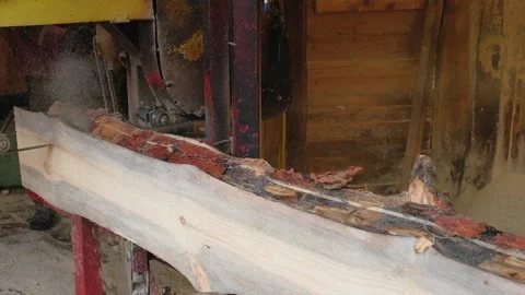 Processing and sawing timber at a sawmill. The production process at the sawmill Stock Footage 165562367