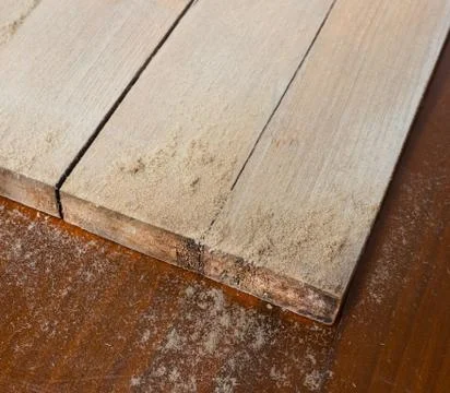 Processing the board with a metal brush. 스톡 사진