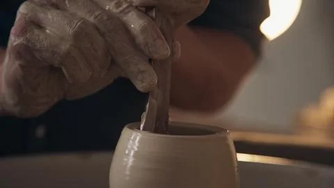 Processing clay ware and making dishes, process. Ceramics Stock Photos