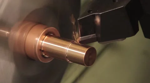 Processing a copper workpiece on a lathe Stock Footage