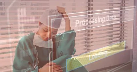 Processing data and loading image over tired healthcare worker in hospital 写真素材