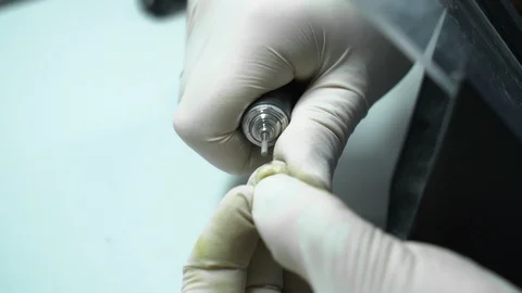 Processing of dental crowns with a drill machine. laboratory. close-up Stock Footage 117572265