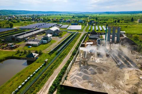 Processing factory at mining site producing cement construction materials. Stock Photos