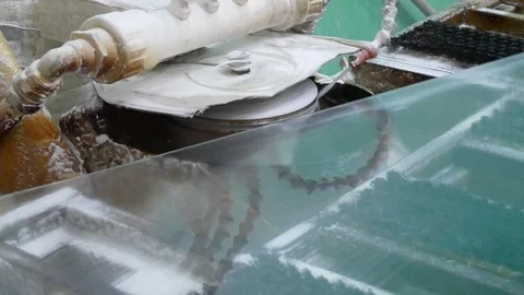 Processing of flat glass.Sharpening the edge on the machine. Stock Footage 122010448