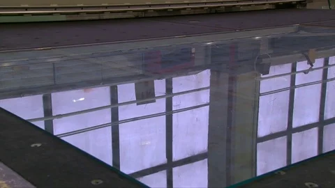 Processing of glass edge, factory of processing of sheet glass on the machines Stock Footage 76462859