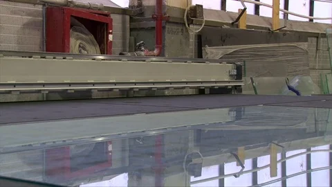 Processing of glass edge, factory of processing of sheet glass on the machines Stock-Footage 76463285