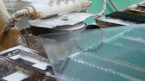 Processing of glass edges at the factory.Chamfering.Turning sheet of glass. Video stock 122126631