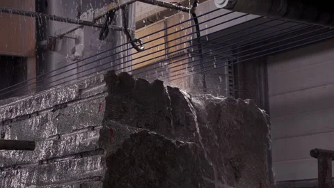 Processing of the granite at the stone factory using huge amounts of water Stockbeeldmateriaal 202699065
