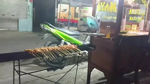 Processing grilled or roasted chicken meat into Satay or Sate Stock Footage 250623161