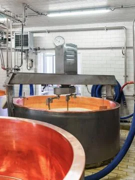 Processing of Gruyere de Comte Cheese in dairy in France Stock Photos