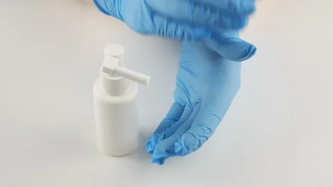 Processing hand disinfectant.Antiseptic in a white bottle. 스톡 동영상 128126935