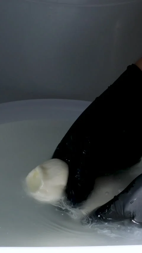 Processing of Italian caciocavallo cheese people melt the cheese to make Italian Stock Footage 278482011
