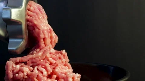 Processing lard or meat into minced meat in a meat grinder at home, close-up Stock Footage 257236327